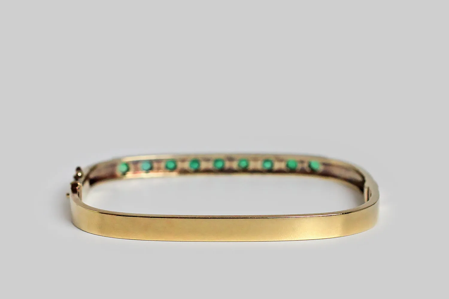 Vintage 1980s Rectangular Hinged Bangle Bracelet with Emeralds in 14k Gold